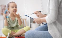 child speaking to therapist